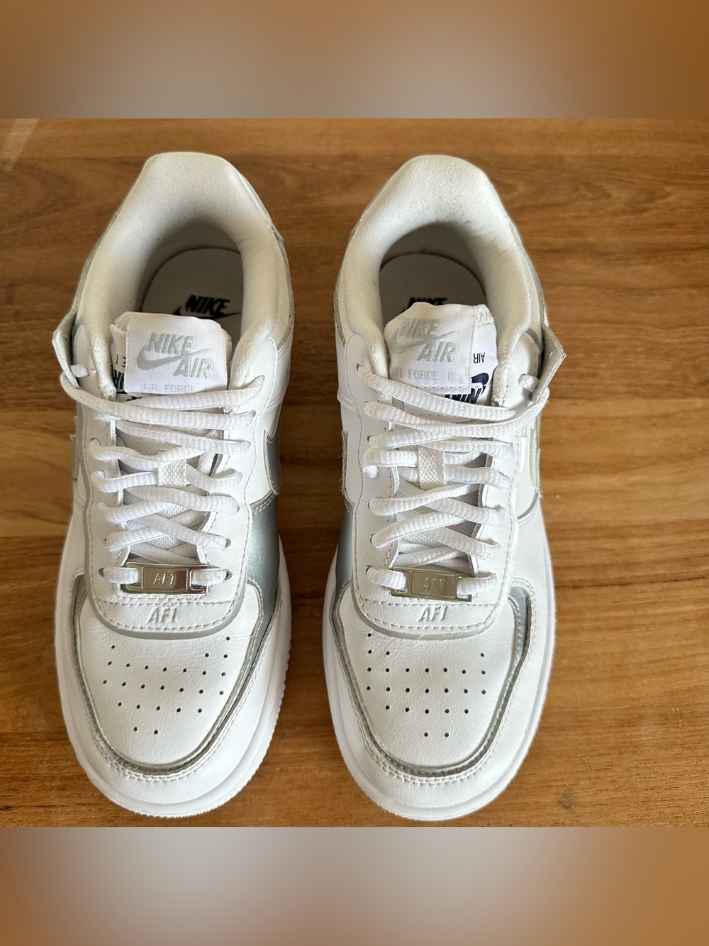 Nike White Sneakers with Metallic Silver Swoosh - Picture 4 of 11